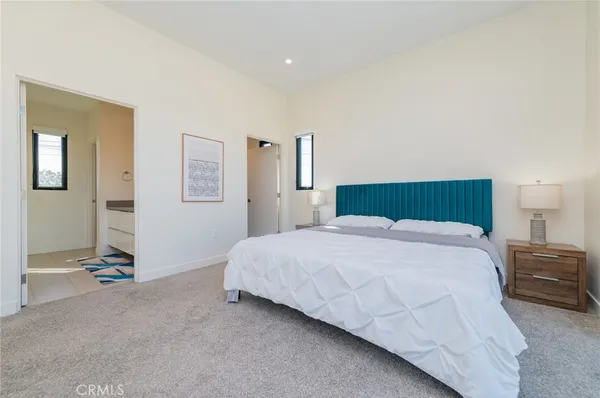 a bedroom with a bed and a cabinets