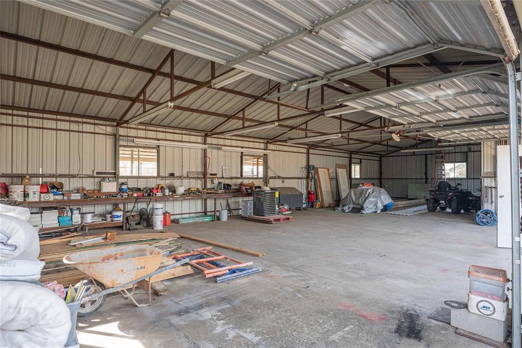 900 Silver Creek Azle Road Azle, TX 76020 - Photo 26 of 27 Spacious metal building featuring a vaulted ceiling and concrete flooring