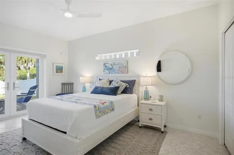 a bathroom with a granite countertop sink a large mirror and a shower