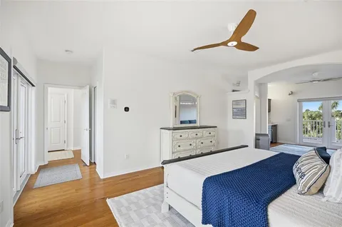 a bedroom with a bed and a lamp on table