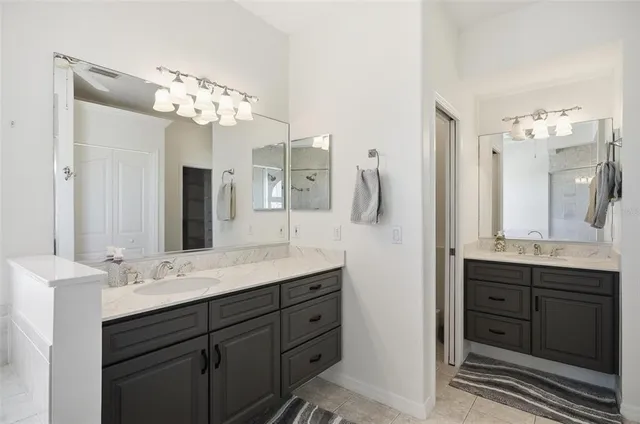 a living room with furniture a flat screen tv and wooden floor