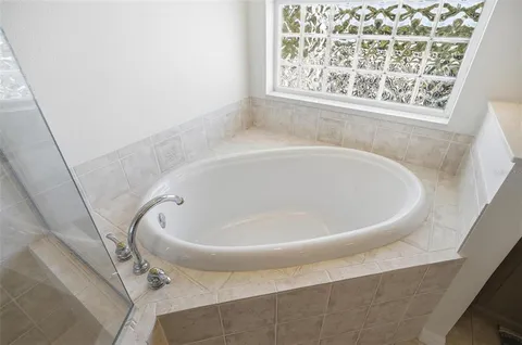 a living room with fireplace and a flat screen tv