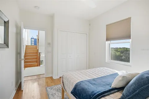a view of a livingroom with furniture and floor to ceiling window