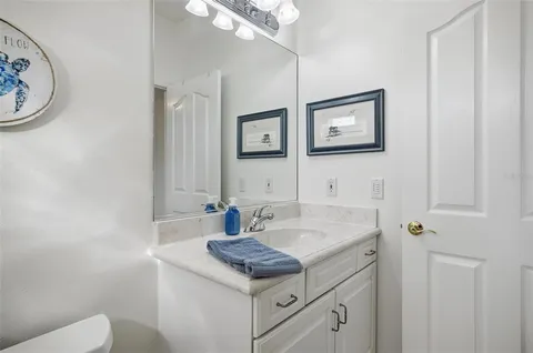 a living room with furniture a fireplace and a chandelier