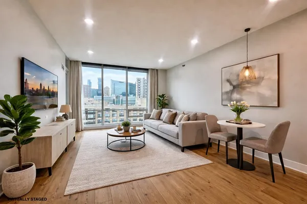 a living room with furniture and a large window