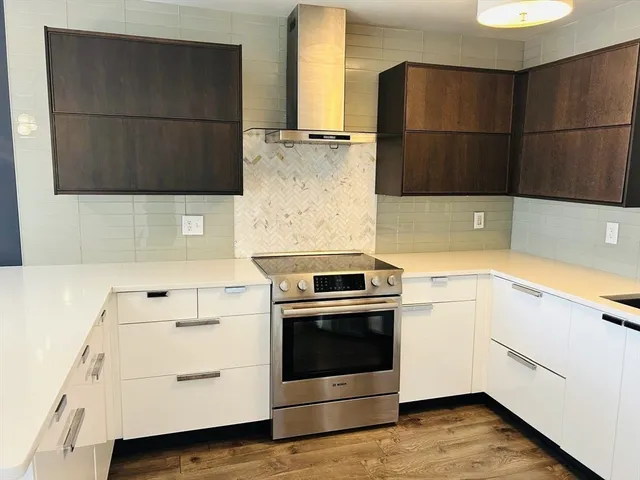a kitchen with a stove and a refrigerator