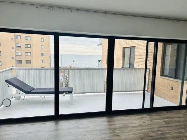 a view of a room with wooden floor and chair