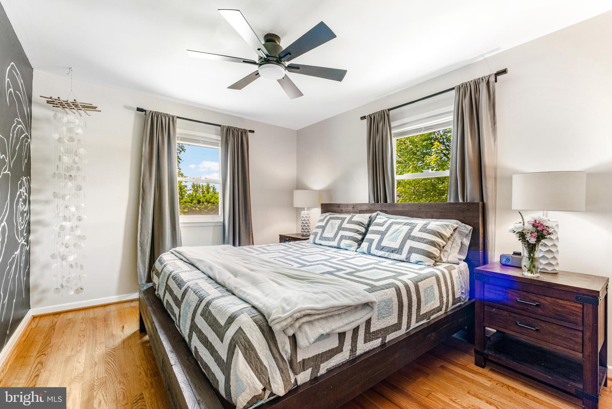 922 Cherokee Trail Frederick, MD 21701 - Photo 13 of 40 a bedroom with a bed and a chandelier