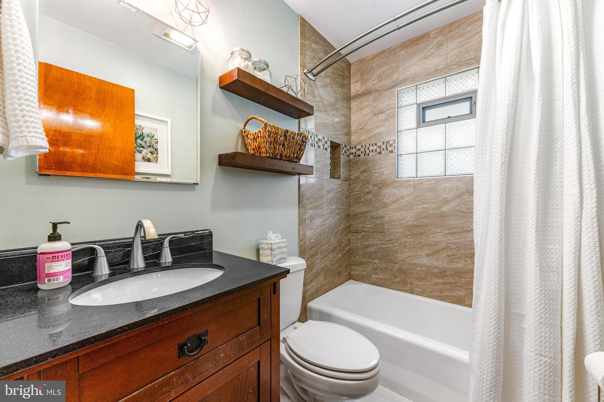 922 Cherokee Trail Frederick, MD 21701 - Photo 19 of 40 a bathroom with a sink a toilet and shower