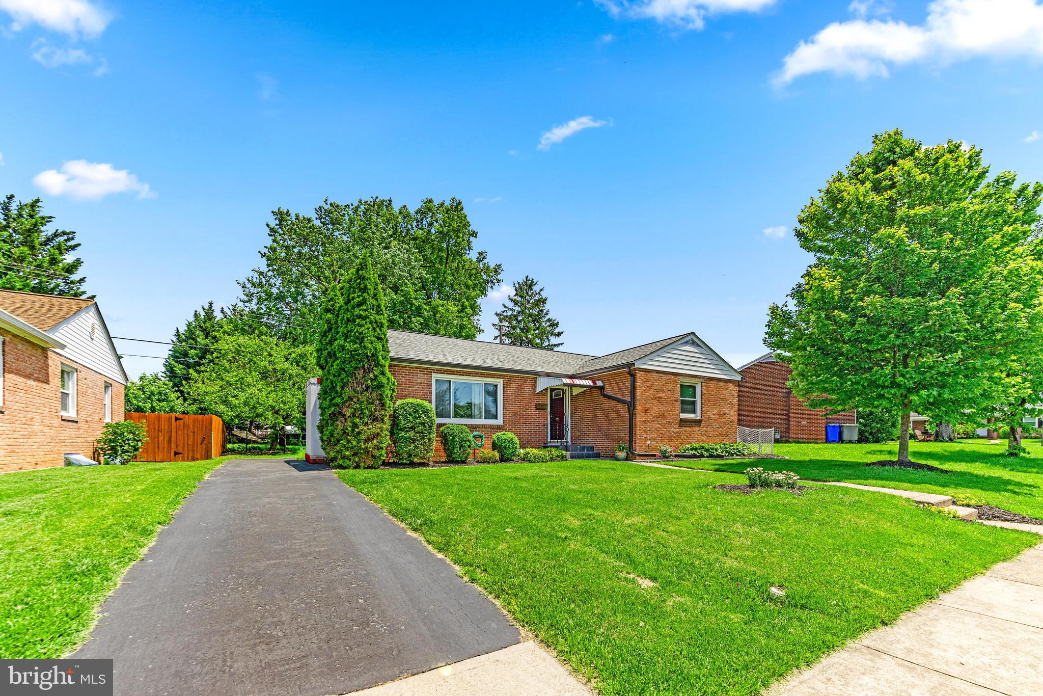 922 Cherokee Trail Frederick, MD 21701 - Photo 2 of 40 a front view of house with yard and green space