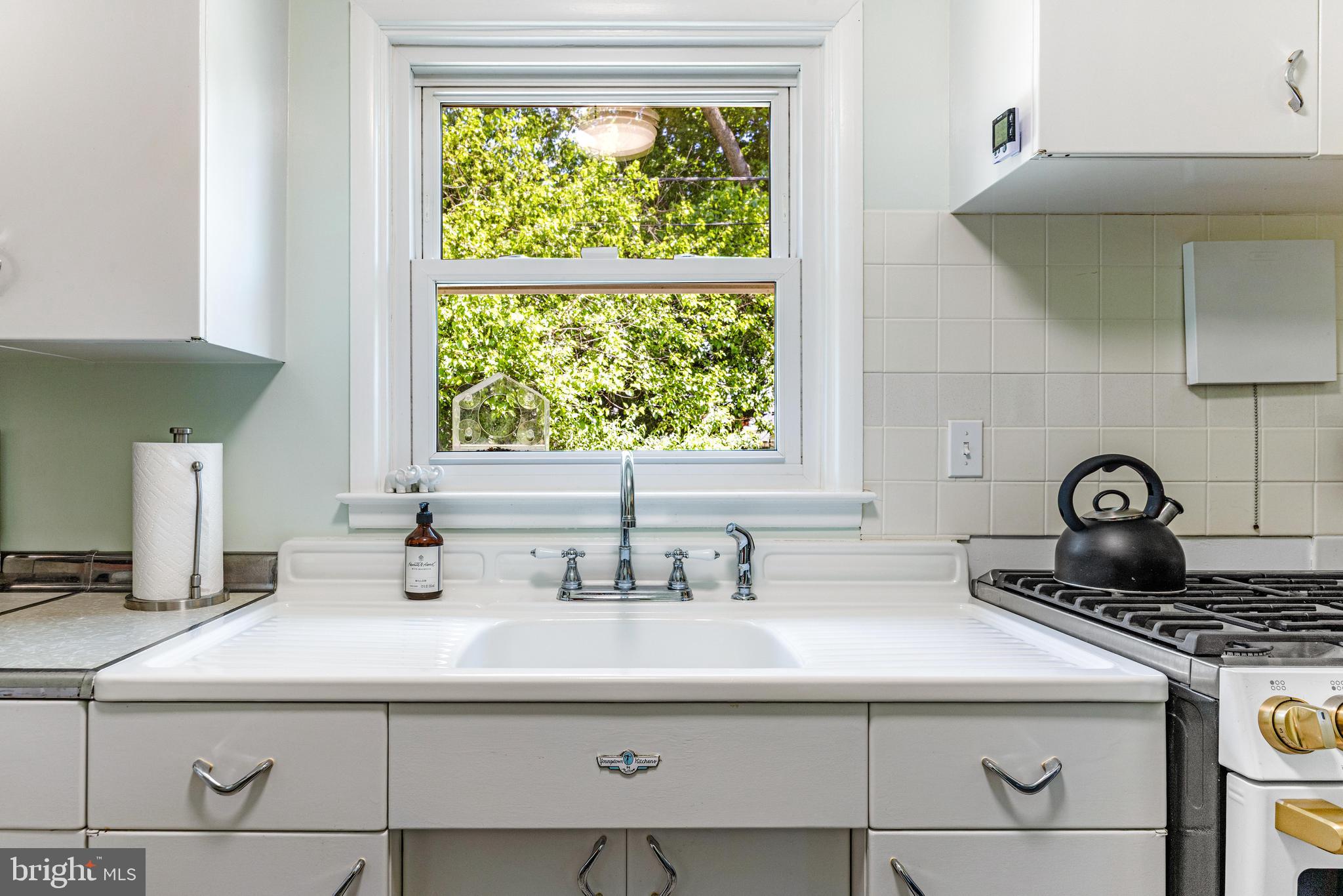 922 Cherokee Trail Frederick, MD 21701 - Photo 22 of 40 a kitchen with a sink cabinets and a window