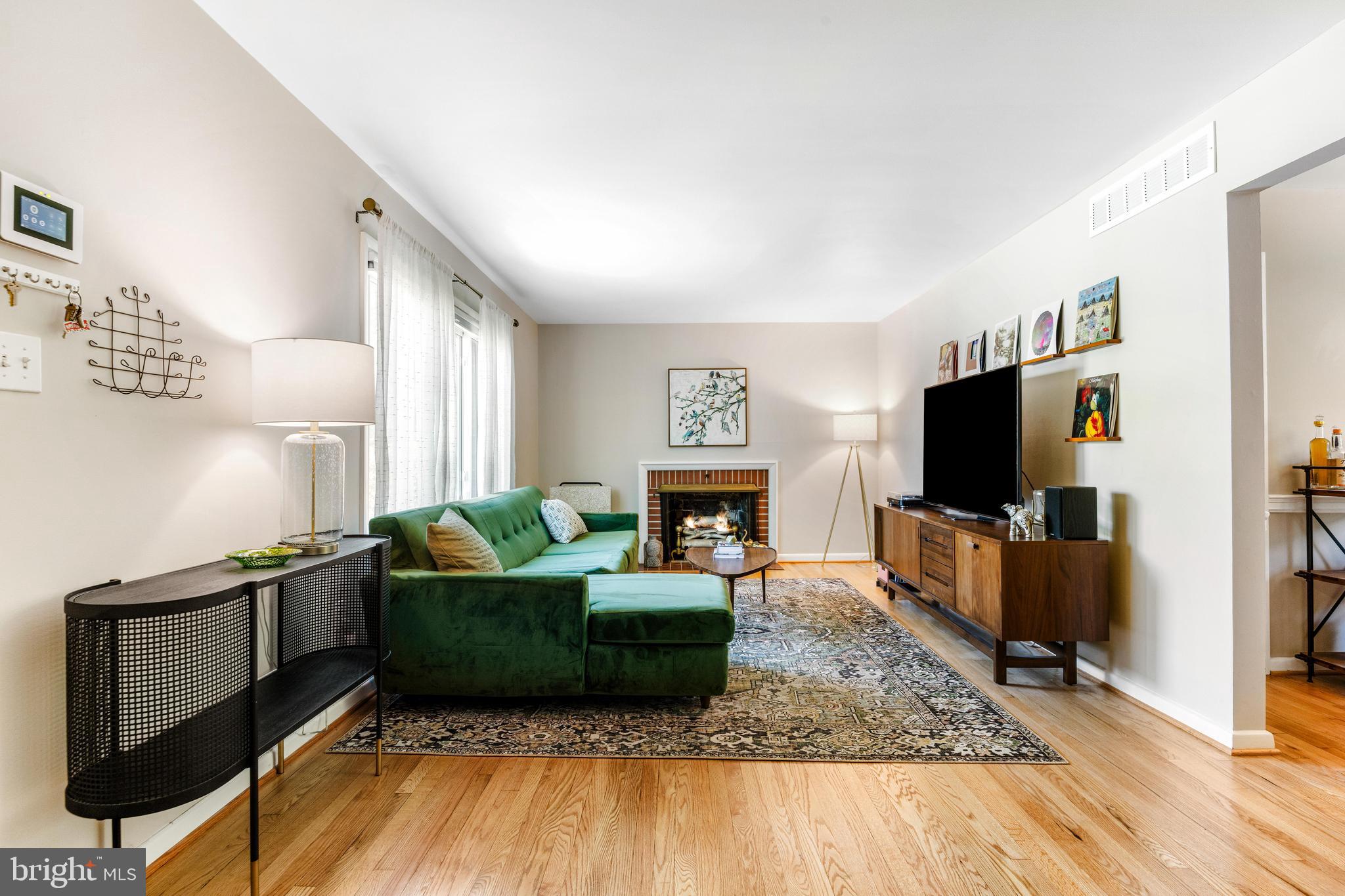 922 Cherokee Trail Frederick, MD 21701 - Photo 5 of 40 a living room with furniture and a flat screen tv