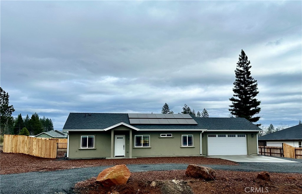 5824 Sawmill Road Paradise, CA 95969 - Photo 1 of 1 a front view of a house with a garden