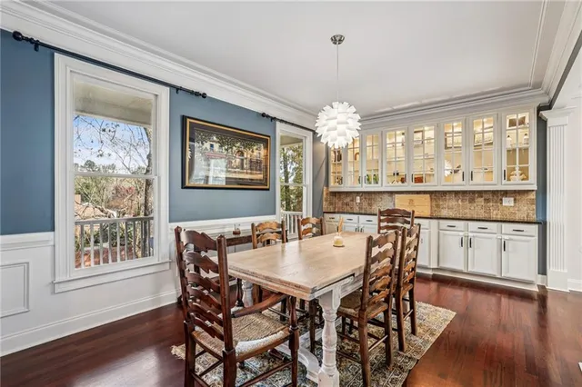 a view of a dining room with furniture window and wooden floor
