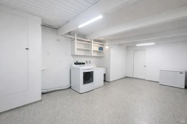 a room with storage and a white door