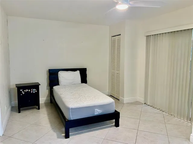 a bedroom with a bed and a table