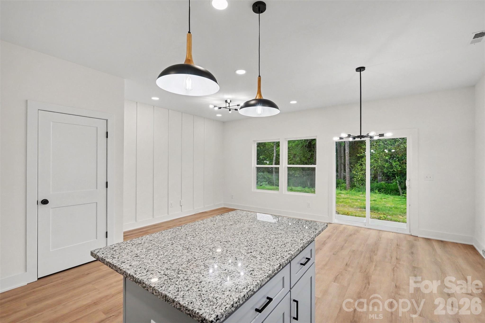 7521 Lawyers Road Charlotte, NC 28227 - Photo 18 of 35 a view of a kitchen with a sink and wooden floor