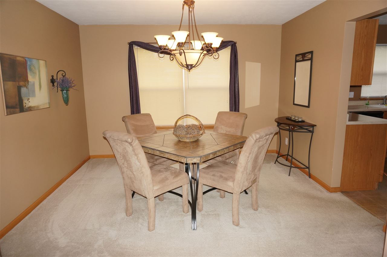 1439 Rock Island Road Davis Junction, IL 61020 - Photo 8 of 25 a dining room with furniture and window