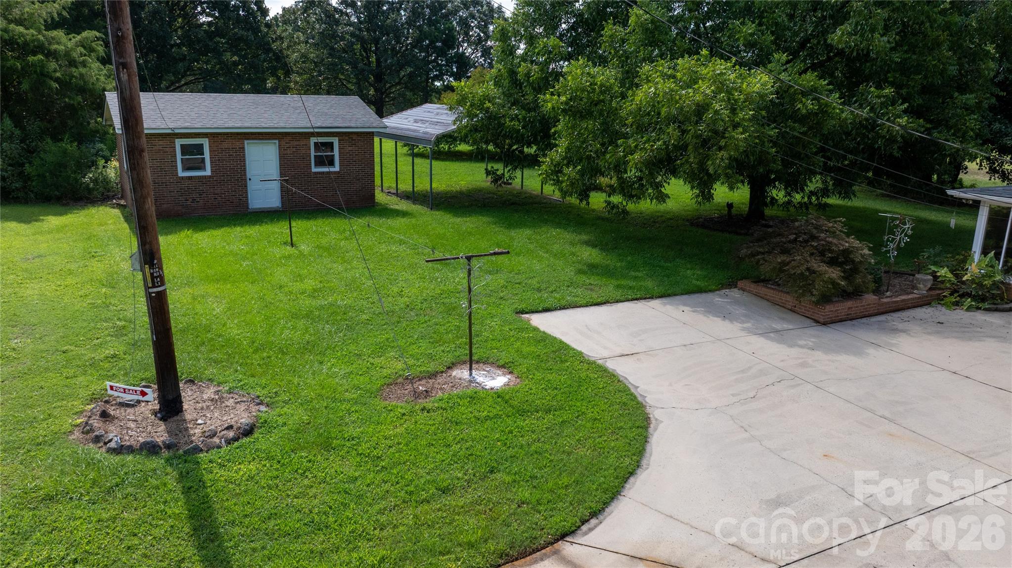 20402 Norton Road Albemarle, NC 28001 - Photo 13 of 34 a view of a house with backyard and garden