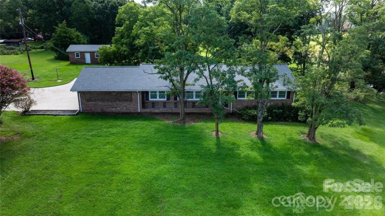 20402 Norton Road Albemarle, NC 28001 - Photo 2 of 34 a view of a house with a backyard and a tree