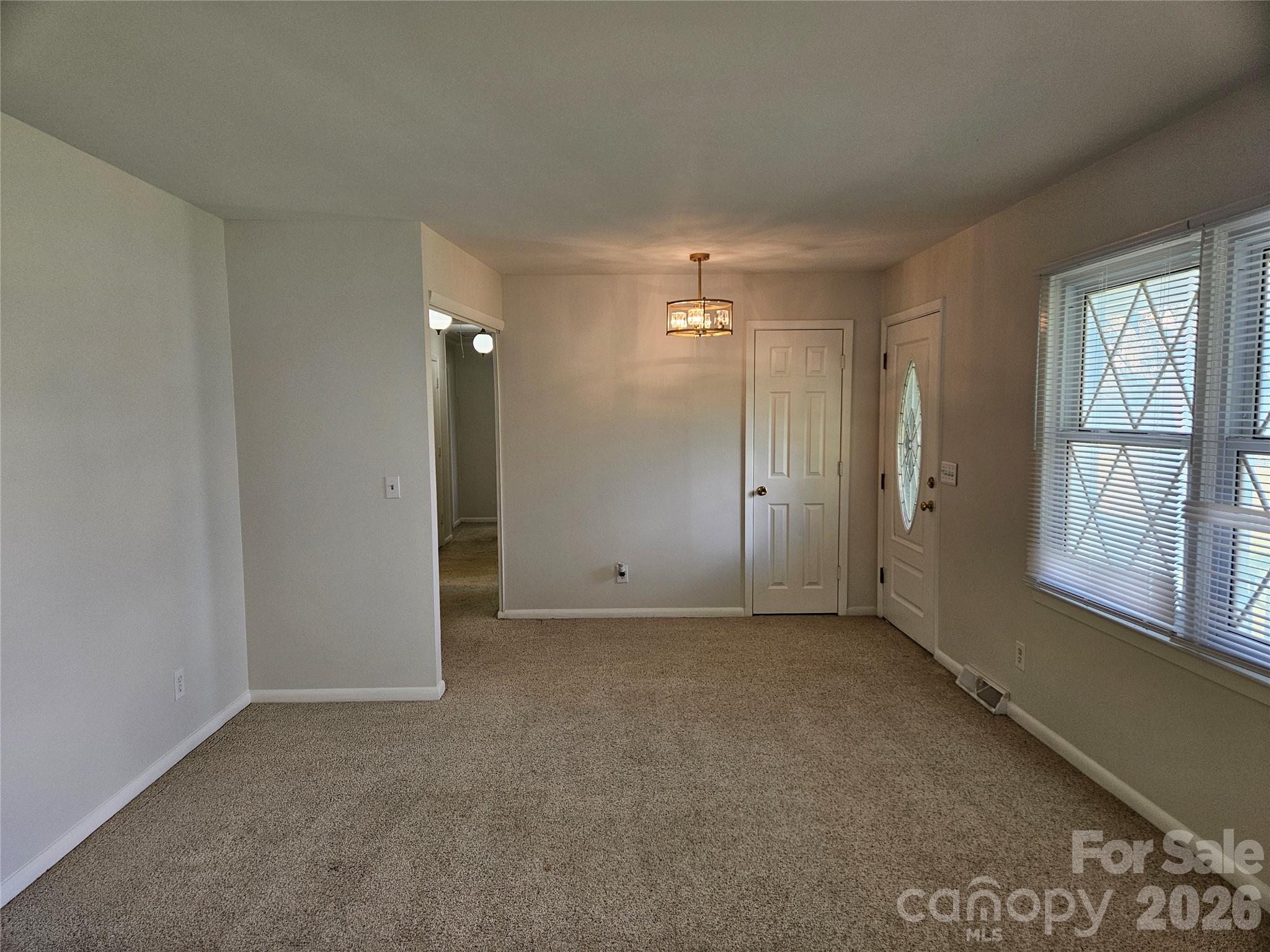 20402 Norton Road Albemarle, NC 28001 - Photo 21 of 34 an empty room with windows and closet