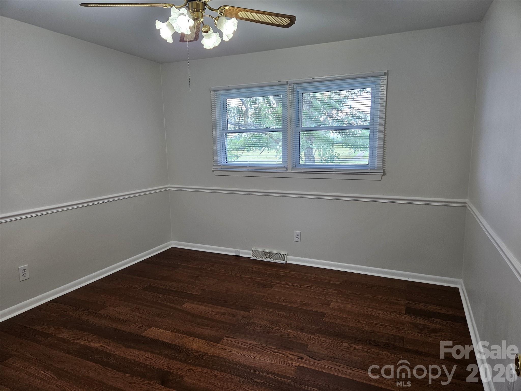 20402 Norton Road Albemarle, NC 28001 - Photo 28 of 34 a view of an empty room with wooden floor and a window
