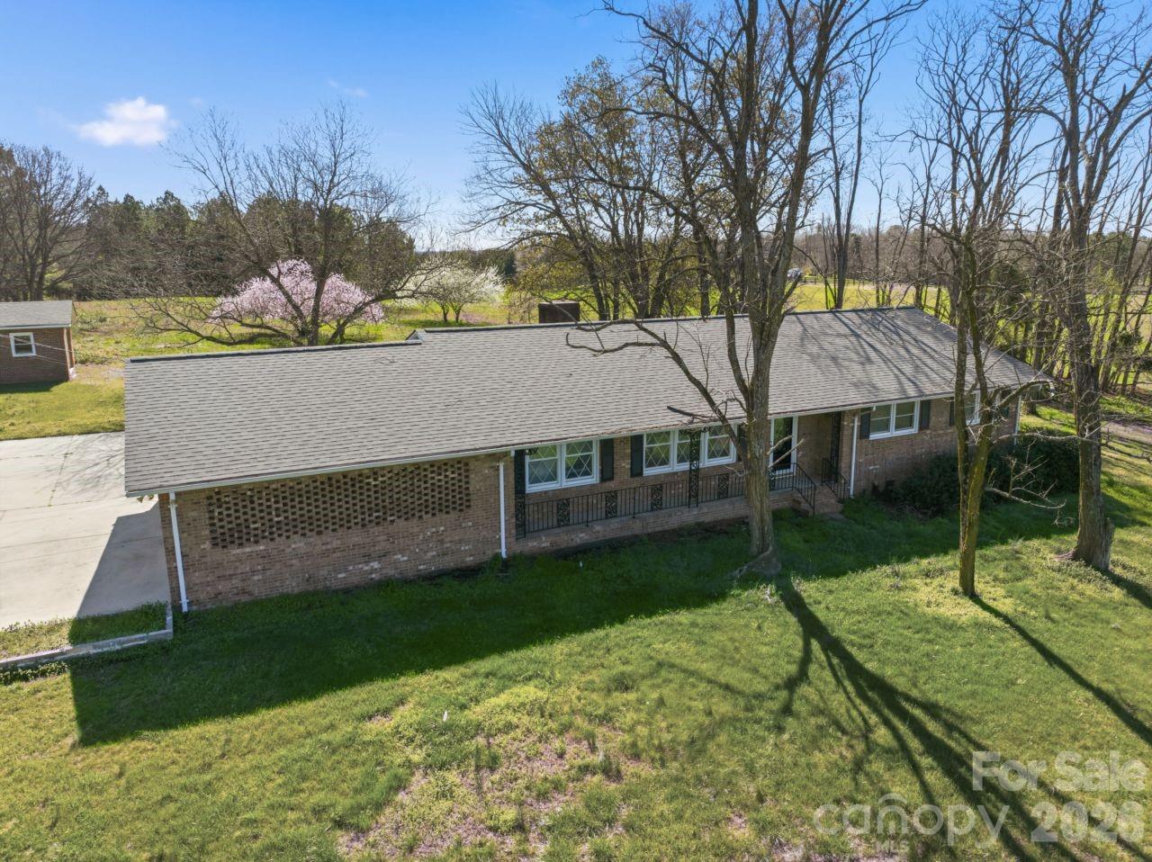 20402 Norton Road Albemarle, NC 28001 - Photo 4 of 34 a view of a house with a yard and tree s