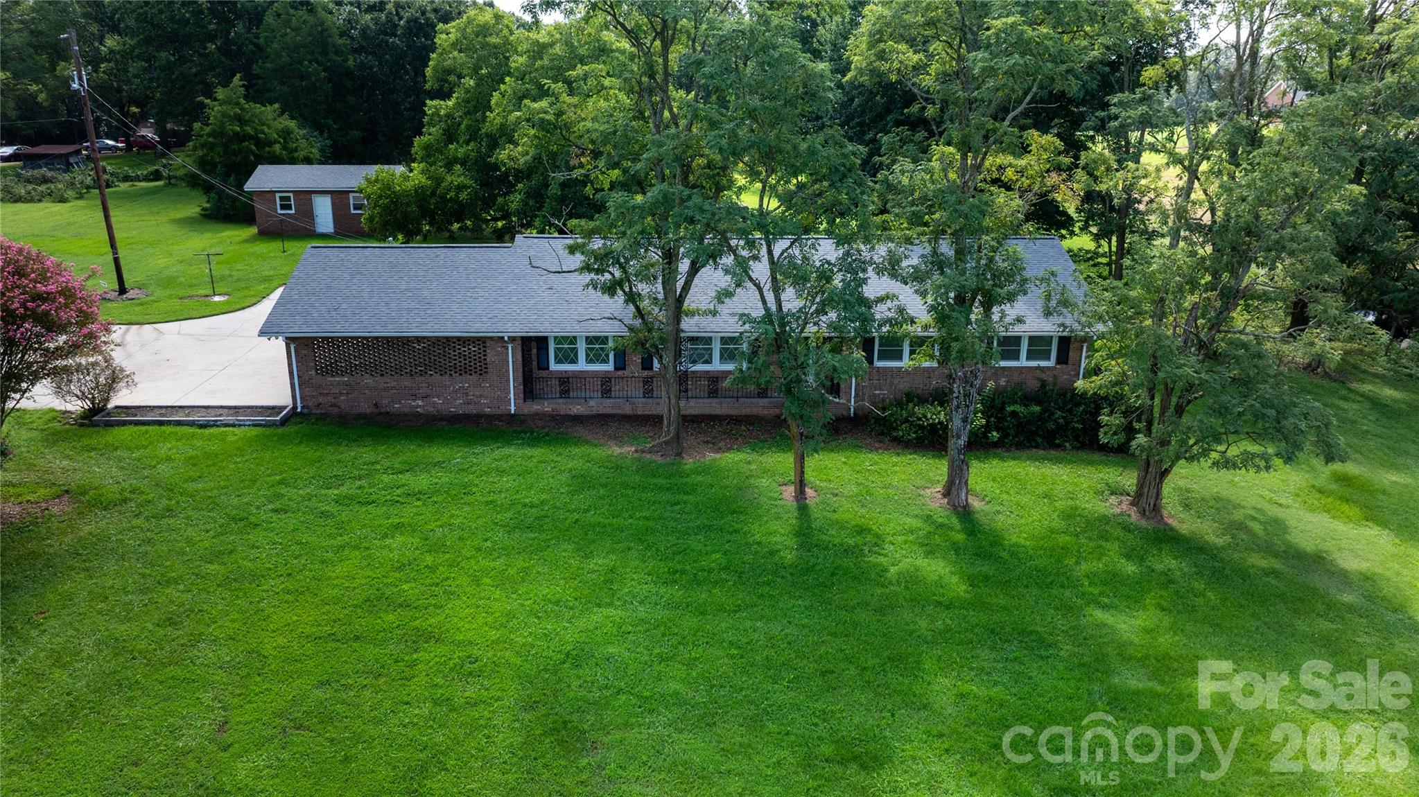 20402 Norton Road Albemarle, NC 28001 - Photo 5 of 34 a view of a house with a backyard and a tree