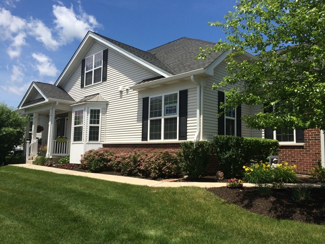 1012 Riviera Drive Elgin, IL 60124 - Photo 1 of 25 a front view of a house with a yard