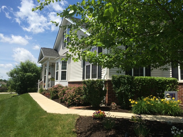 1012 Riviera Drive Elgin, IL 60124 - Photo 2 of 25 a front view of a house with a yard