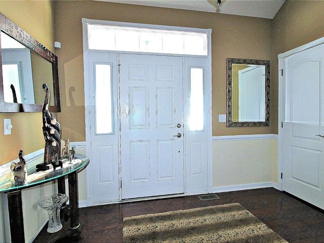 1012 Riviera Drive Elgin, IL 60124 - Photo 3 of 25 a view of an entryway with wooden floor