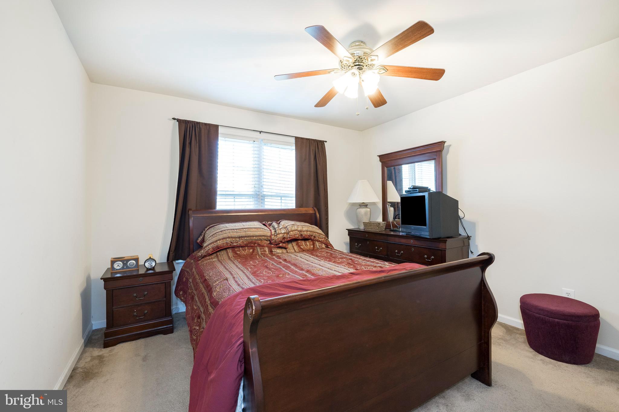 877 Church Road Harleysville, PA 19438 - Photo 12 of 48 a bedroom with a bed and a television