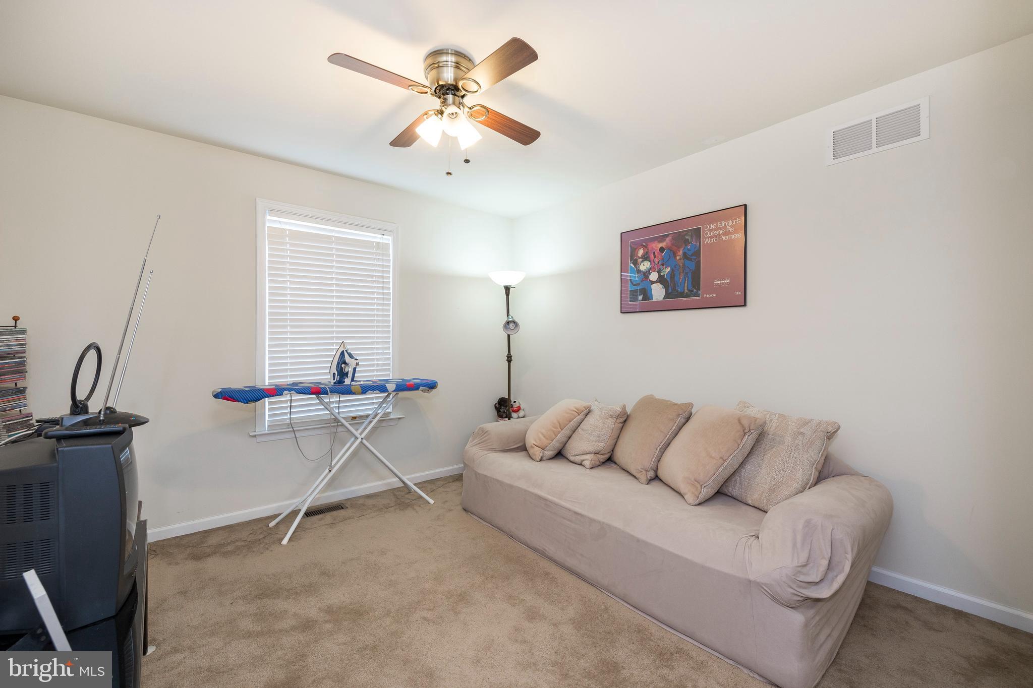 877 Church Road Harleysville, PA 19438 - Photo 15 of 48 a living room with furniture and a ceiling fan