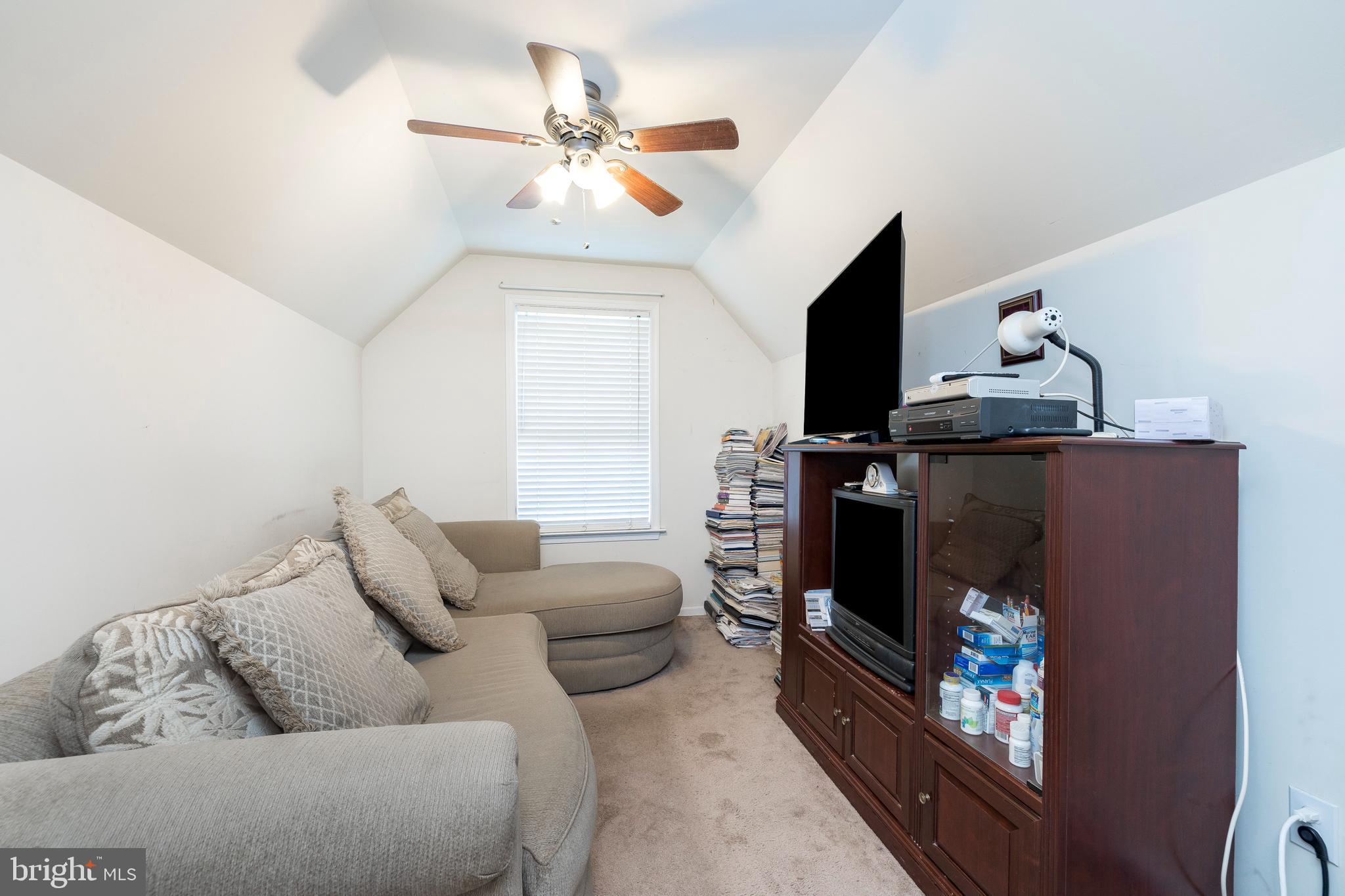 877 Church Road Harleysville, PA 19438 - Photo 16 of 48 a living room with furniture a flat screen tv and a fireplace