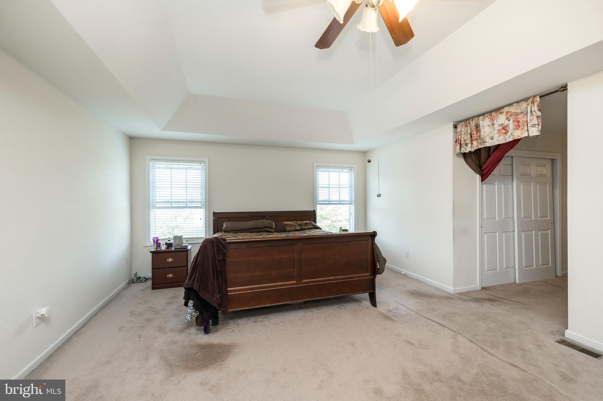 877 Church Road Harleysville, PA 19438 - Photo 18 of 48 a room with a bed and a chandelier
