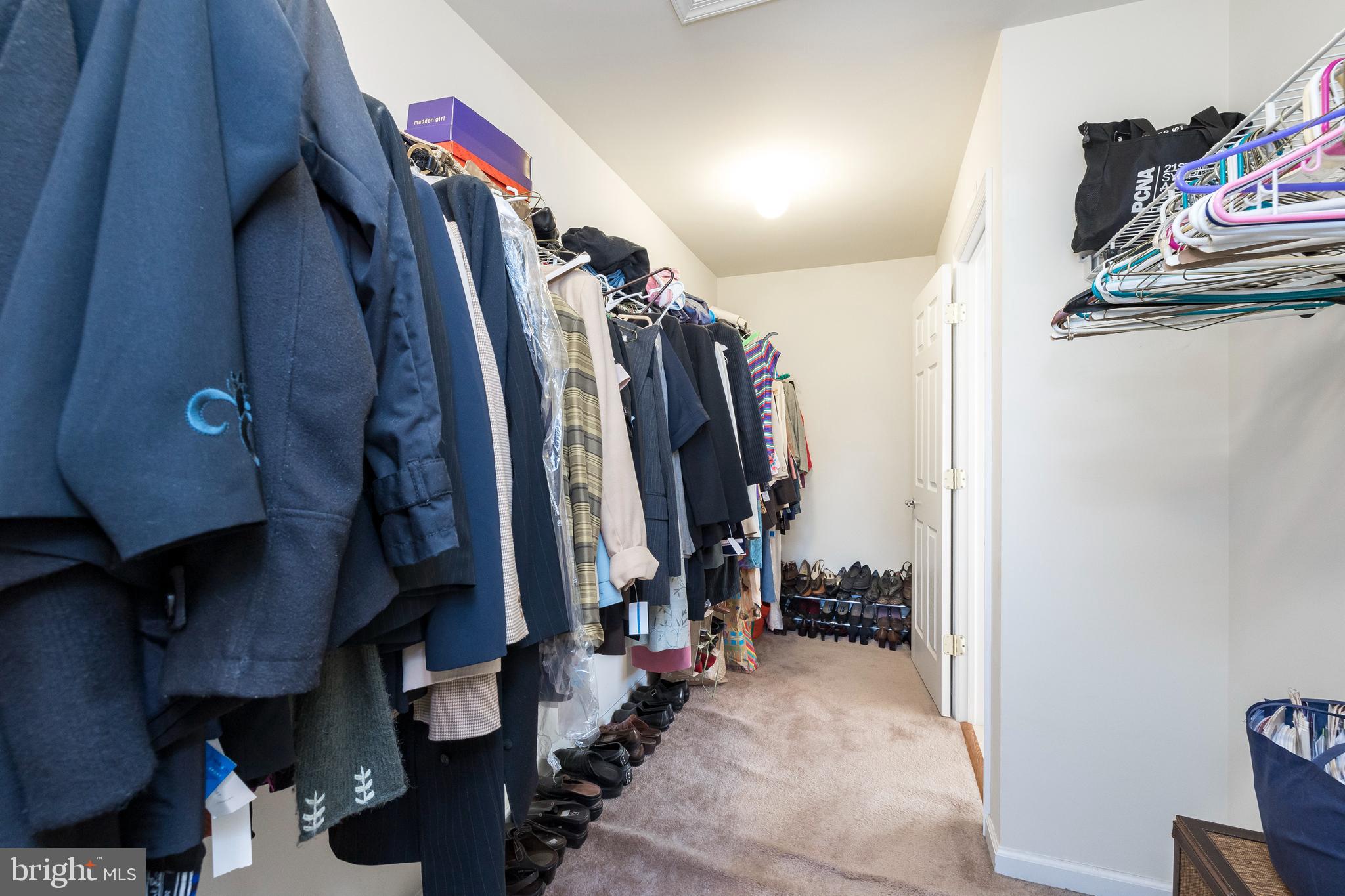 877 Church Road Harleysville, PA 19438 - Photo 21 of 48 a view of walk in closet with clothes and shoes