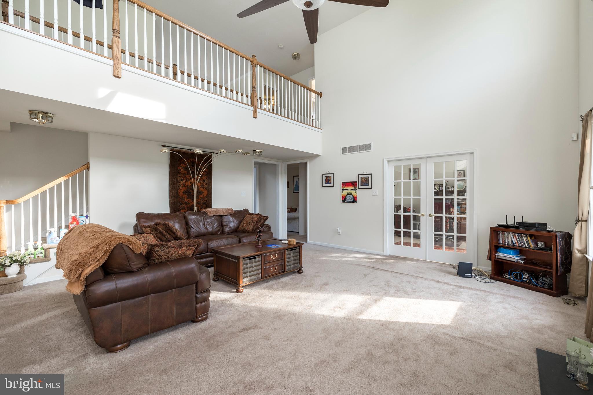 877 Church Road Harleysville, PA 19438 - Photo 31 of 48 a living room with furniture and a flat screen tv