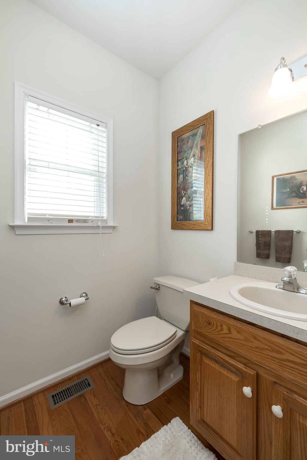 877 Church Road Harleysville, PA 19438 - Photo 9 of 48 a bathroom with a toilet a sink and a window