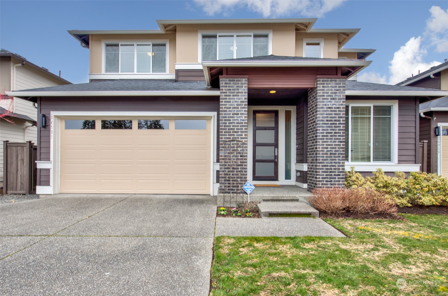 a front view of a house with garden