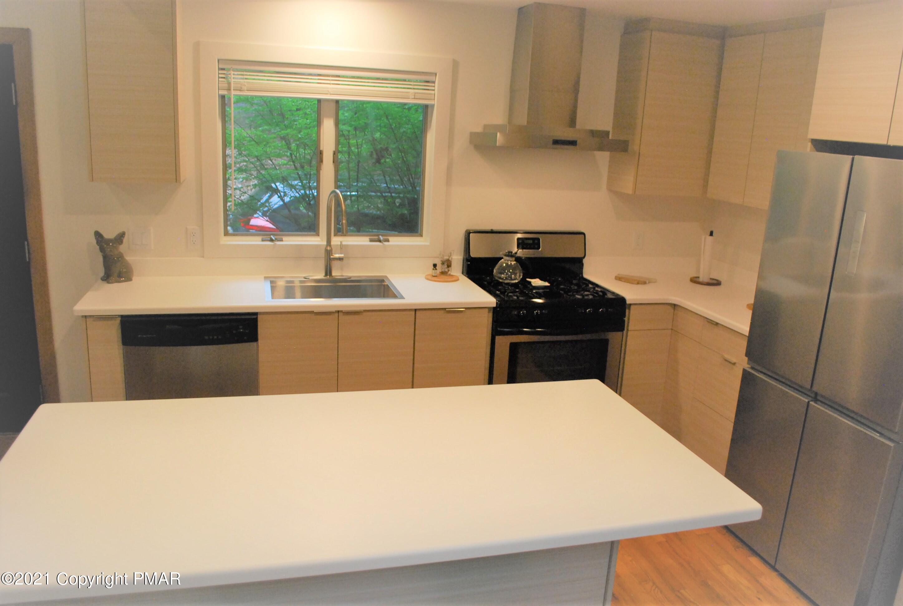 178 Edinburgh Road Bushkill, PA 18324 - Photo 12 of 54 a large white kitchen with sink refrigerator and window