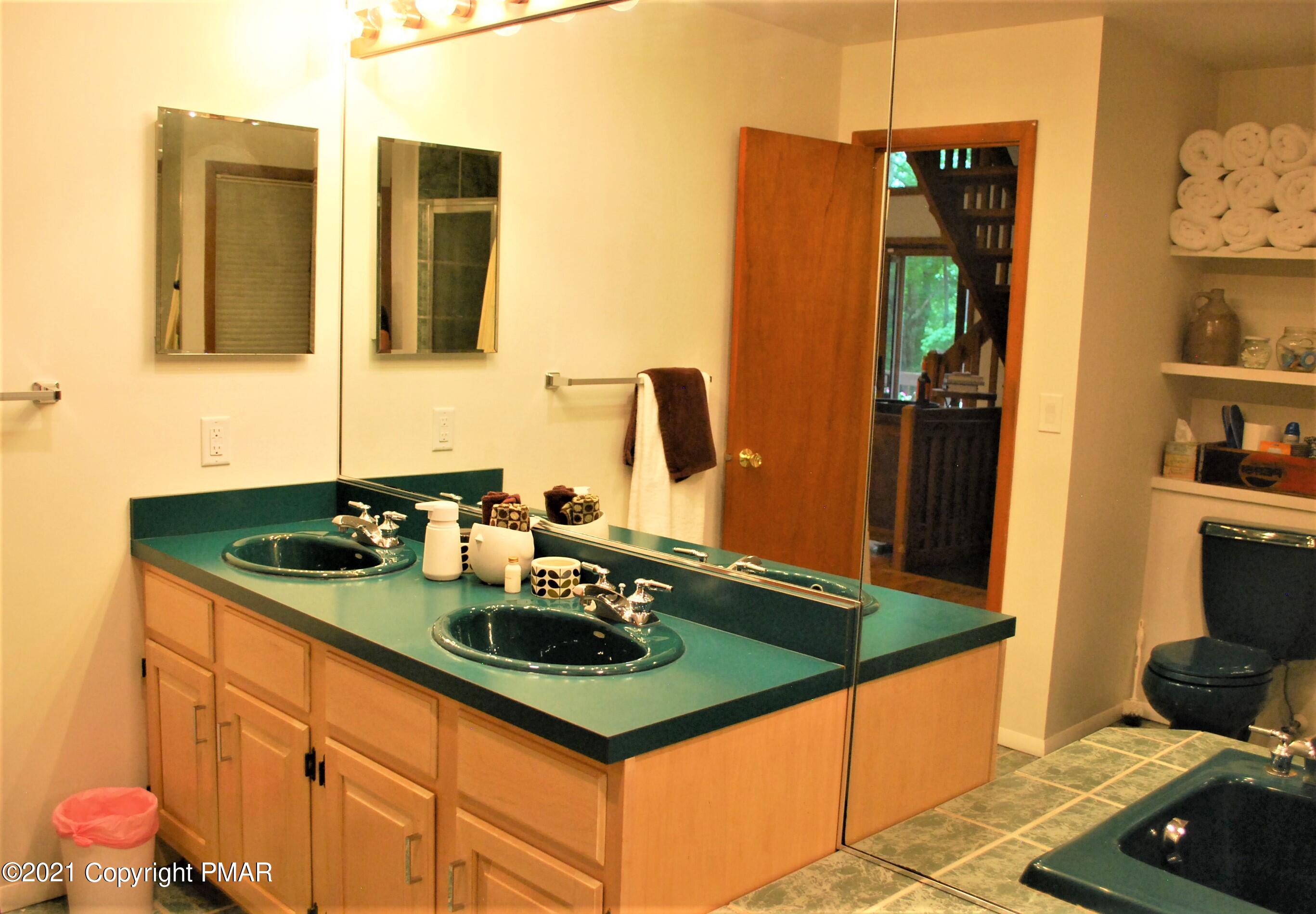 178 Edinburgh Road Bushkill, PA 18324 - Photo 20 of 54 a bathroom with sink and mirror