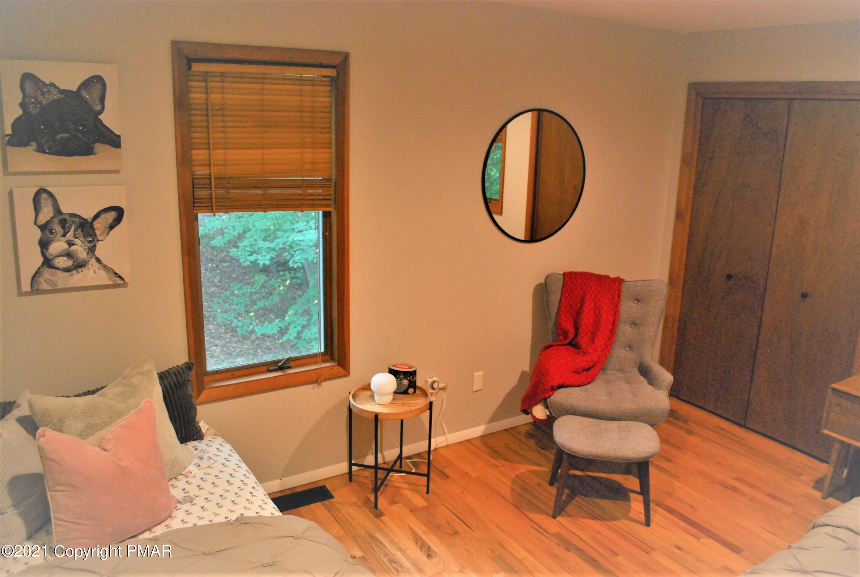 178 Edinburgh Road Bushkill, PA 18324 - Photo 29 of 54 a living room with furniture and a window