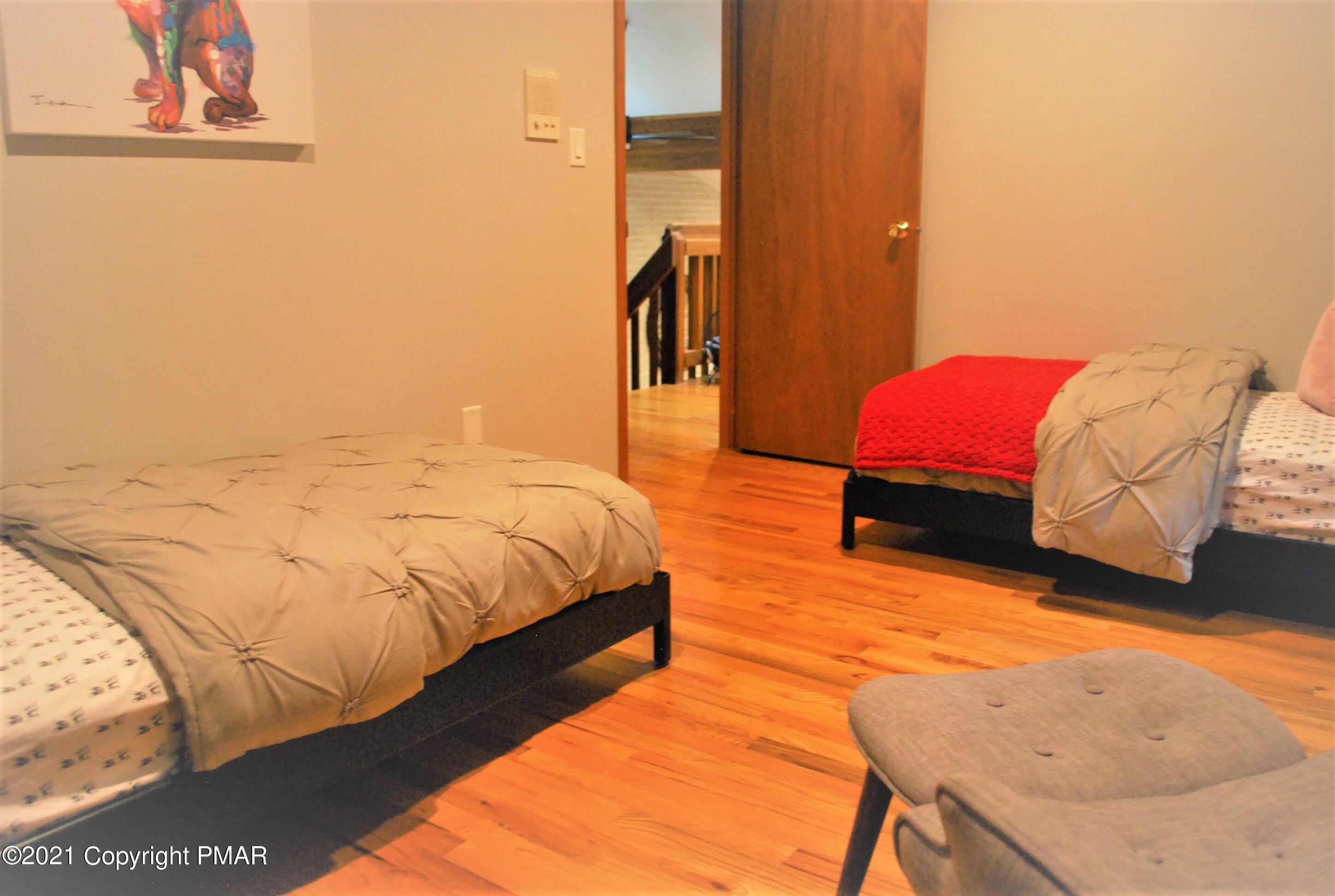 178 Edinburgh Road Bushkill, PA 18324 - Photo 31 of 54 a bedroom with a bed and a flat screen tv