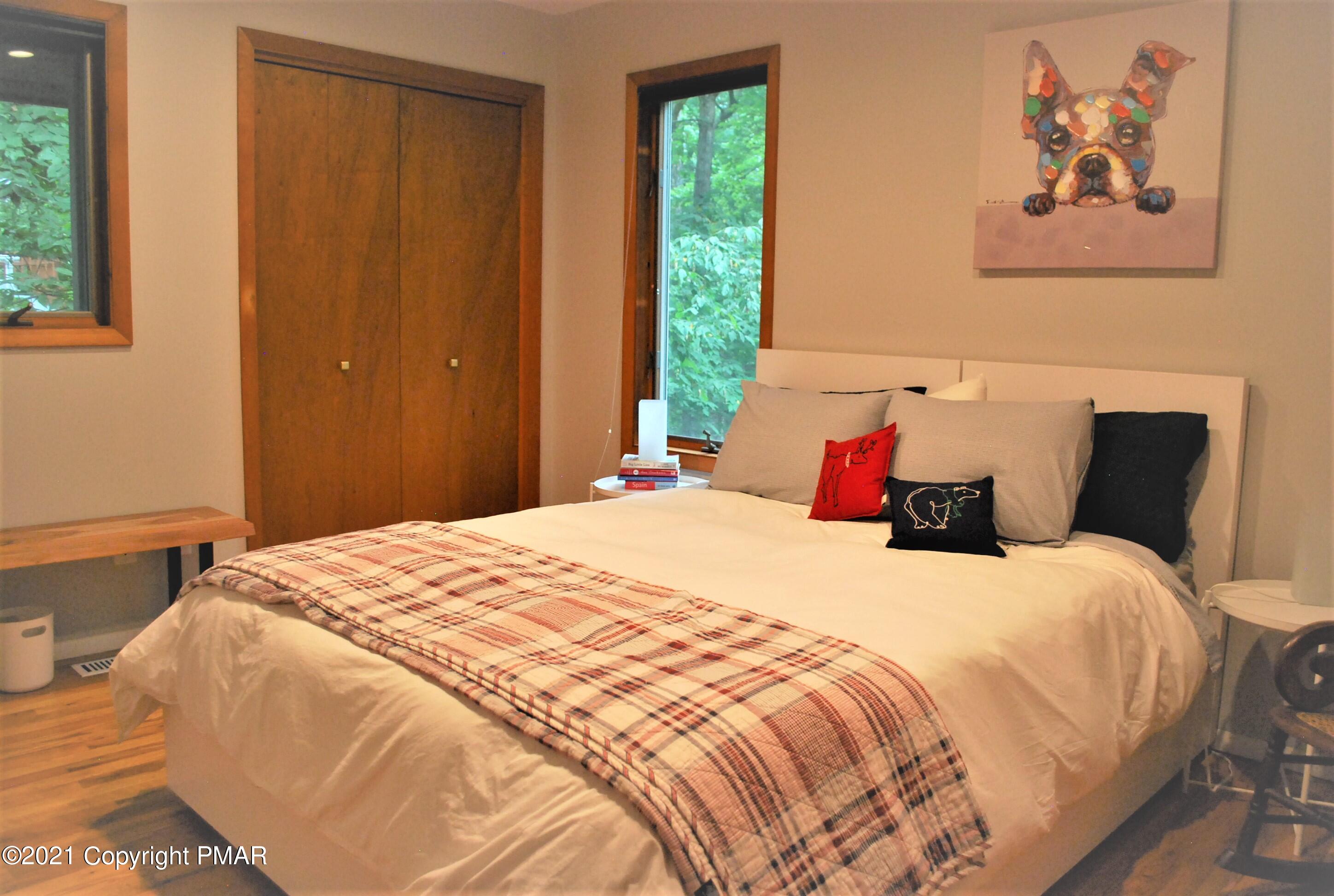 178 Edinburgh Road Bushkill, PA 18324 - Photo 32 of 54 a bedroom with bed and wall painting