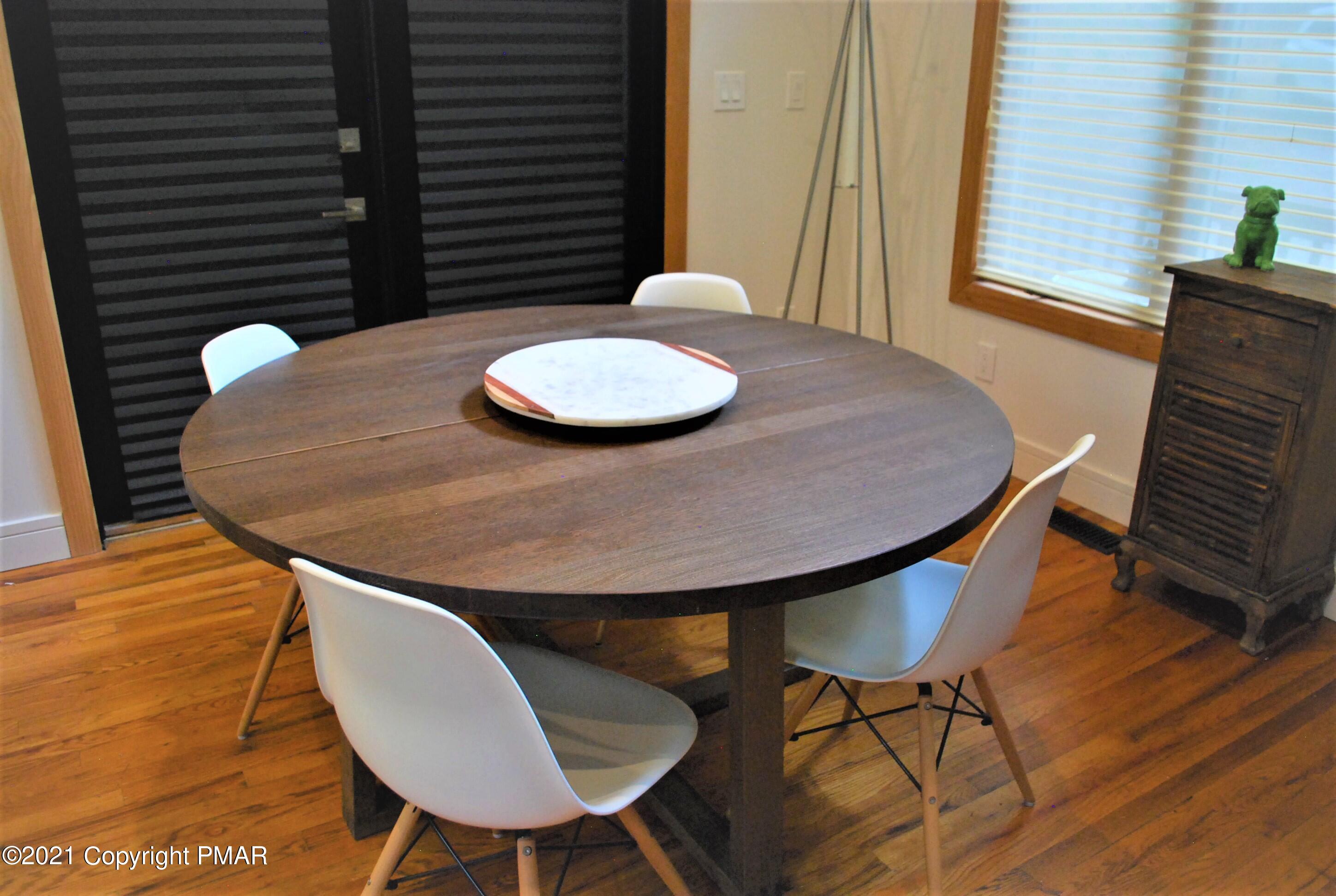 178 Edinburgh Road Bushkill, PA 18324 - Photo 10 of 54 a view of a dining room with furniture and wooden floor