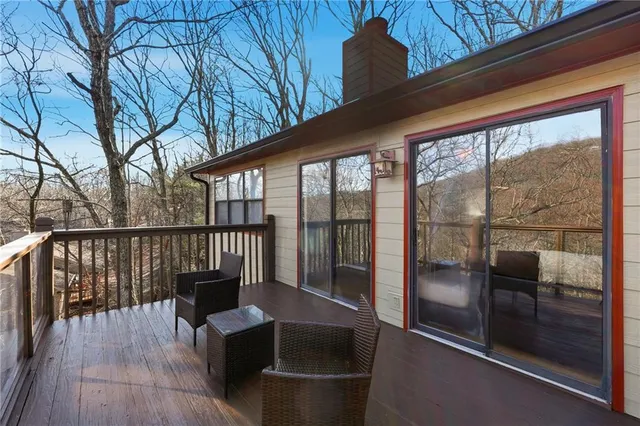 a view of a balcony with chairs