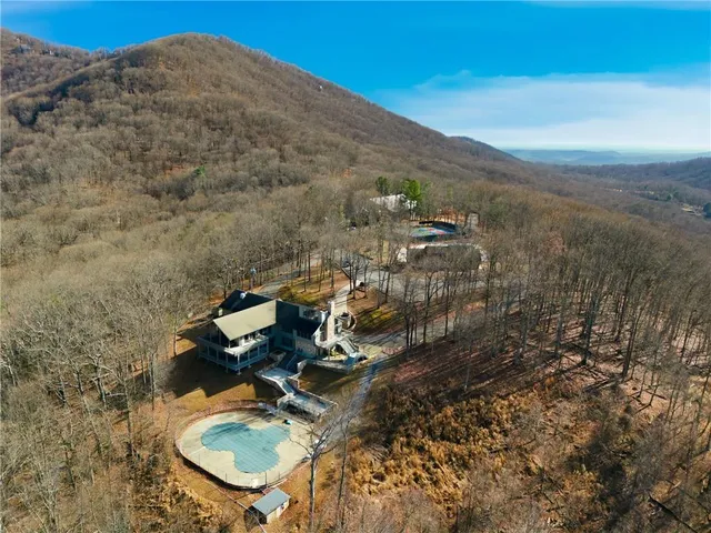 an aerial view of a kitchen with outdoor seating