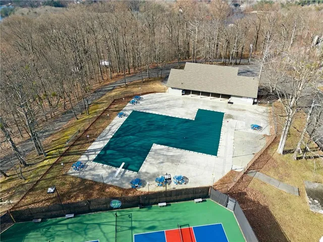 an aerial view of house with a swimming pool