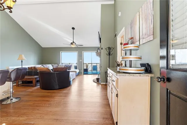a living room with furniture window and wooden floor