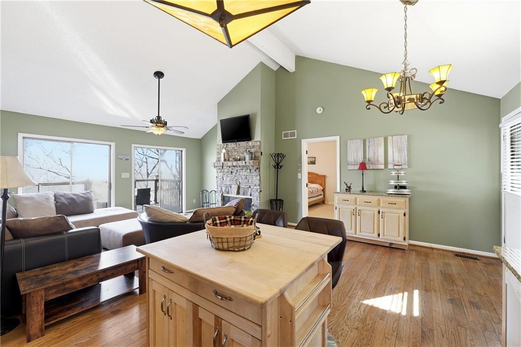 408 Alpine Drive Jasper, GA 30143 - Photo 6 of 42 a view of a dining room with furniture a chandelier and wooden floor